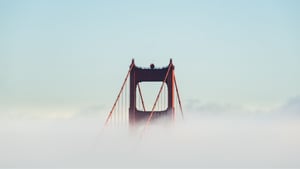 San Francisco bridge in the clouds as a concept of software development company in USA