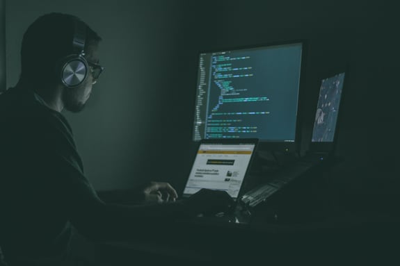 working at computer by night, as a concept of web development in San Francisco